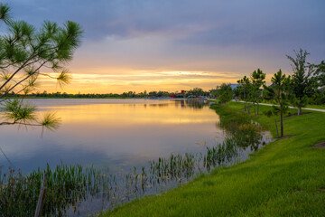 Sunset over lake water in southern tropical wetlands. Amazing Florida nature