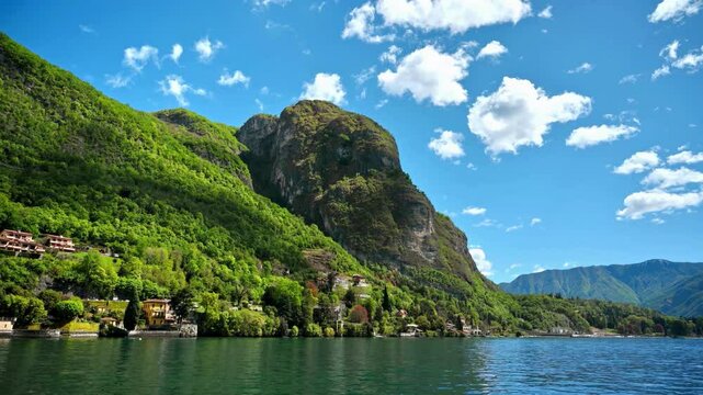 Stunning panoramic views of Lake Como and the picturesque town of Menaggio, Italy, surrounded by mountains and lush nature. Ideal for travel and nature lovers.