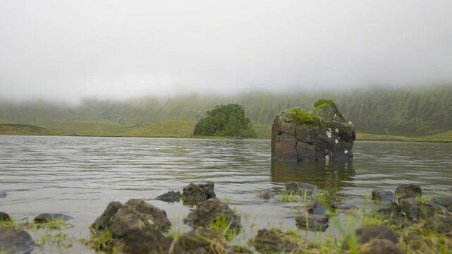 Azores, amazing Corvo island, in the middle of the Atlantic Ocean, green Corvo crater with the beautiful lake of Lagoa do Cachimbo.