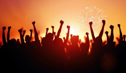 Fototapeta premium Silhouetted Crowd Celebrating During Sunset with Fireworks Display in the Background for Festive Events and Outdoor Gatherings