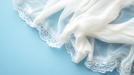 White sheer fabric with delicate lace trim