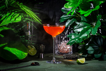 Naked and Famous, alcoholic cocktail drink with mezcal, orange bitters, yellow liqueur and lime...