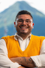 Photograph of gay man posing and smiling at the camera