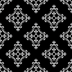 Damask seamless pattern in the style of baroque. Traditional classic black and white ornament. Design for elaborate borders, tiles, ceramic pottery, and clothing.