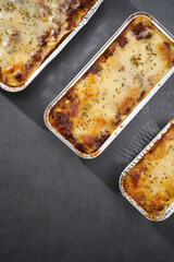 Top View Beef Lasagna on gray surface 