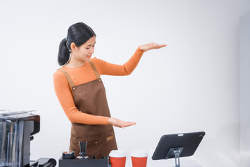 Asian female barista with a beautiful smile, skillfully making coffee in a cozy small shop, creating a warm and welcoming atmosphere for customers in the charming cafe