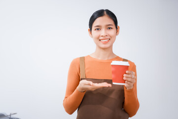 Asian female barista with a beautiful smile, skillfully making coffee in a cozy small shop, creating a warm and welcoming atmosphere for customers in the charming cafe