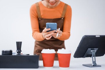 Asian female barista with a beautiful smile, skillfully making coffee in a cozy small shop, creating a warm and welcoming atmosphere for customers in the charming cafe