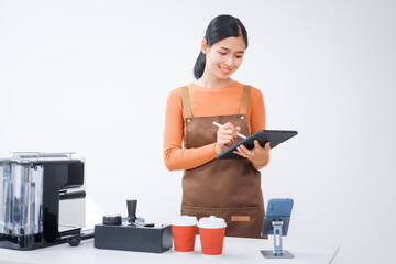 Asian female barista with a beautiful smile, skillfully making coffee in a cozy small shop, creating a warm and welcoming atmosphere for customers in the charming cafe