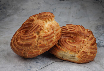 Profiterole cake. Eclair in the shape of a ring.