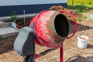 small electric concrete mixer prepares mortar for building a new house