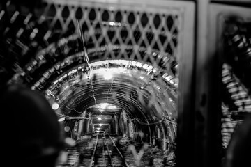 Selective focus on caged cart descending into an anthracite Lackawanna Coal Mine Tour at McDade Park.