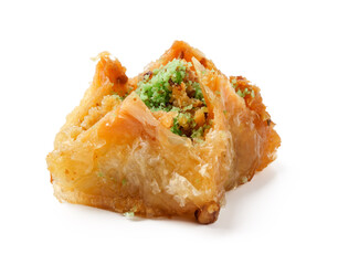 Delicious dessert with flaky pastry and nut filling enjoyed at a cultural event in a vibrant setting