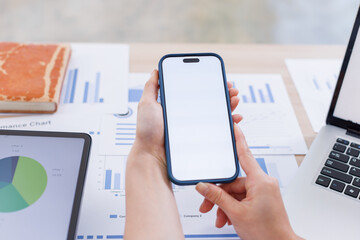 Close up Business woman using calculator and laptop and phone for do math finance on wooden desk, tax, accounting, statistics and analytical research concept