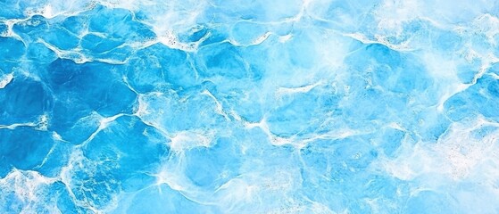 Obraz premium Aerial view of ocean surface with white foam and light blue water creating abstract patterns