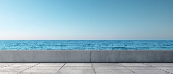 Fototapeta premium Ocean view from concrete terrace under a clear blue sky with a calm sea horizon