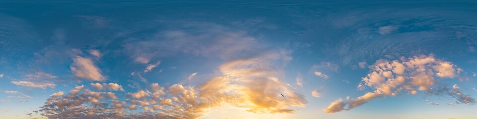 360 panorama of glowing sunset sky with bright Cirrus clouds. Seamless hdr spherical 360 panorama. Sky dome in 3D visualization, sky replacement for aerial drone panoramas. Weather and climate change