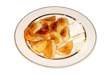 Dumplings with potatoes fried in oil.Potato dumplings with a crispy crust.Fried dumplings with potatoes.
