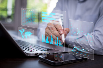 Futuristic data visualization concept featuring holographic charts, graphs, calendar, and a world map displayed above a laptop. Perfect for themes on technology, data analysis, and digital innovation.