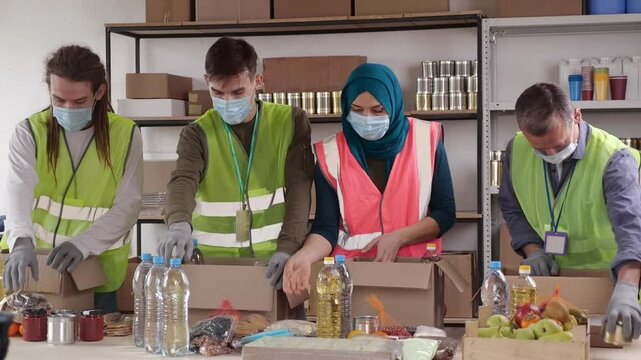 Ramadan Aid for Families. Charity Effort: Muslim Volunteers Packing Food - Powered by Adobe