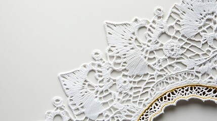 Fototapeta premium Delicate White Lace Doily with Gold Accents