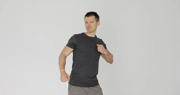 Confident man punches himself in chect