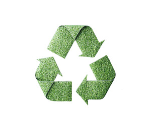 Eco-friendly recycling symbol made of grass.