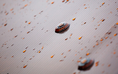 A wet surface with a few drops of water on it