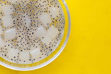 Coconut jelly with basil seeds in syrup