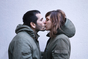 A kiss of an adult couple 