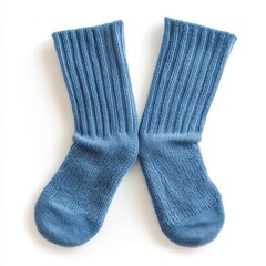 Pair of blue ribbed socks on white background.