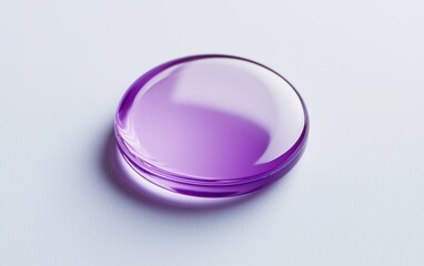 A close-up of a purple button with a modern design on a clean white background.