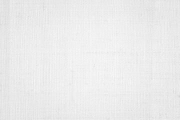 Fototapeta premium White color fabric canvas woven texture background in pattern light blank. Natural gauze linen, carpet wool and cotton cloth textile textured as clean empty for decoration text. Grey sack material.