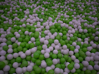 A ball pit, a childhood favorite, filled with an endless supply of green and white play balls. The perfect place for kids to jump, roll, and have fun.