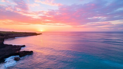 Obraz premium Tropical sunset over ocean cliff, vibrant sky, tranquil waters, peaceful scene, ideal for travel brochures