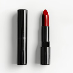 Obraz premium A sleek black lipstick tube with a bold red lipstick bullet exposed. isolated on white background