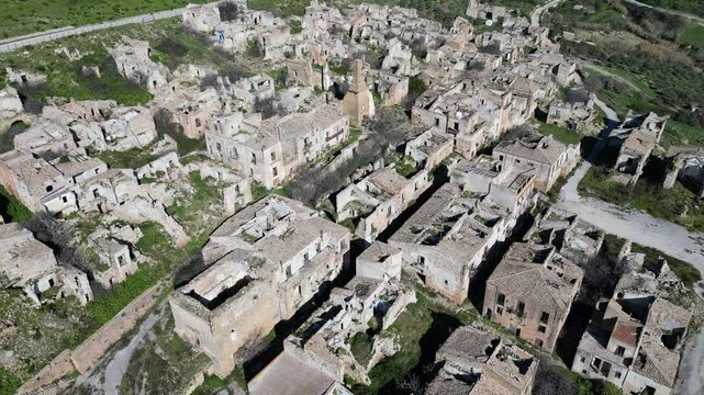 Tilted aerial view of destroyed homes and other buildings in Poggioreale, a town that was at the epicenter of the 1968 Belice earthquake in Sicily Italy
