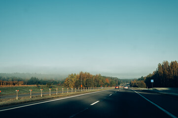 foggy autumn asphalt road, travel