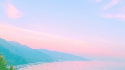 Fototapeta premium Pastel sunset over coastal mountains with soft pink and blue hues creates a serene vista