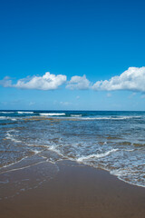 Cyprus Alagadi Turtle Beach. View from the beach to the sea. Magnificent beach, sea and blue cloudy sky. Yellow sand beach. Beach and blue sky.