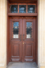 Old historical colorful doors and shutters made of wrought iron and wood. Old historical wooden doors in Cyprus. Doors and shutters of historical stone houses in Nicosia.	