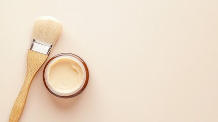 Organic haircare for beautiful styling . Skincare cream in a jar with a brush on a light background.