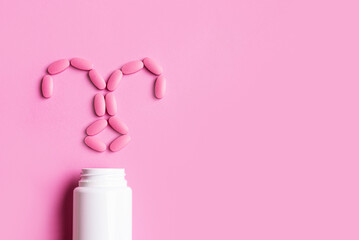 Uterus made of pink pills, minimal concept of female health