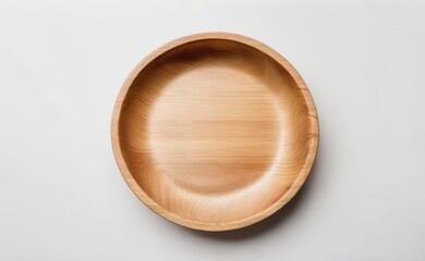 A smooth, organic-shaped wooden bowl rests on a clean white background.