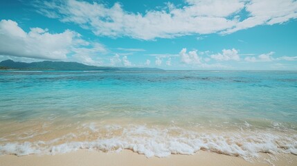 Fototapeta premium A serene beach scene with turquoise waters and distant islands, creating a breathtaking view.