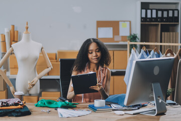 Asia people SME owner or retail fabric craft store work in artist studio home office on desk busy learn online study art class on laptop in digital dress color screen app write job idea skill on web