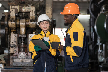 Diversity factory worker working in factory. Male and female engineer wearing safety uniform, helmet and gloves at work factory. Group of worker working at factory