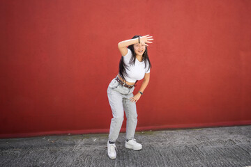 K-pop female dancer performing a choreography in the street
