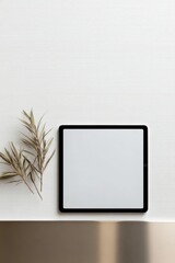 commercial photography for advertising campaign showcasing ultra-glossy tablet with blank screen resting flat on metallic