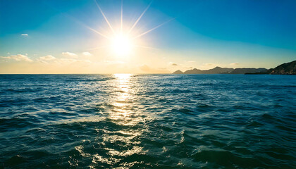 Stunning sunset over a calm ocean with distant mountains. The sun's rays create a radiant glow on the water's surface, perfect for travel, nature, or serenity-themed projects.